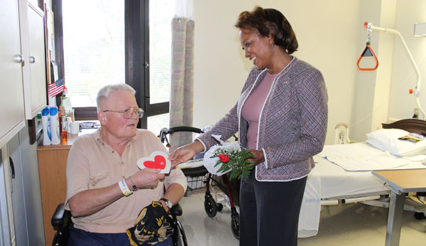 Jennifer gives Valentines gifts to Disabled Veterans at Lake City VA Hospital